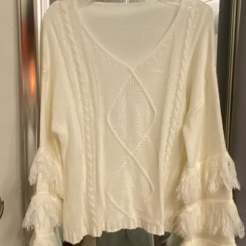 Beautiful white sweater with fringe on sleeves
